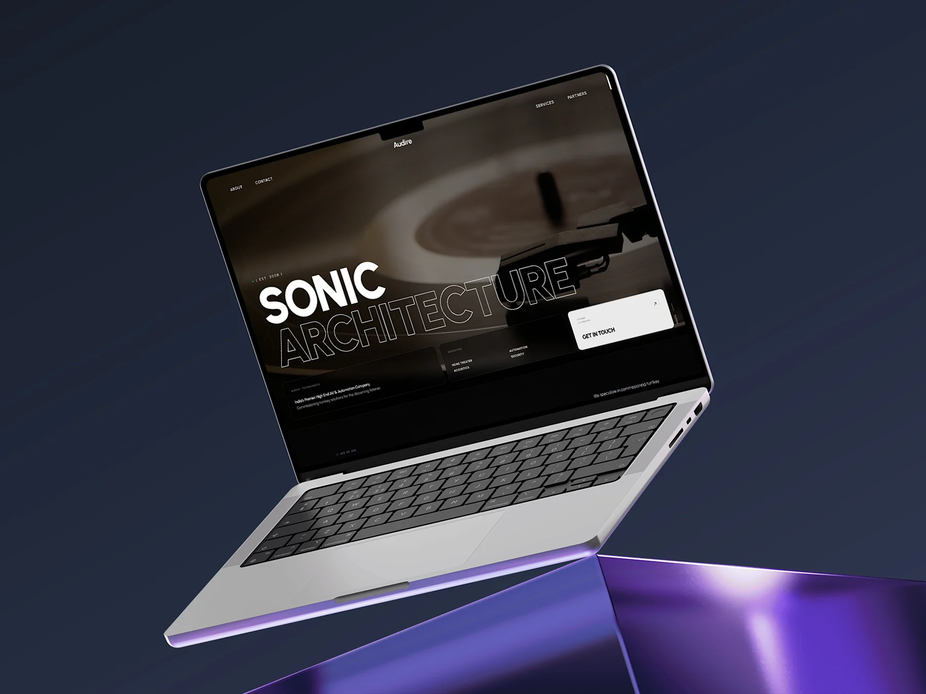 The redesigned Audire website shown on a laptop